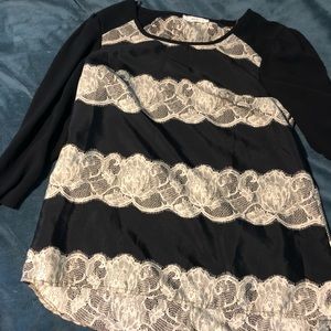 Black quarter length sleeve top with lace stripes